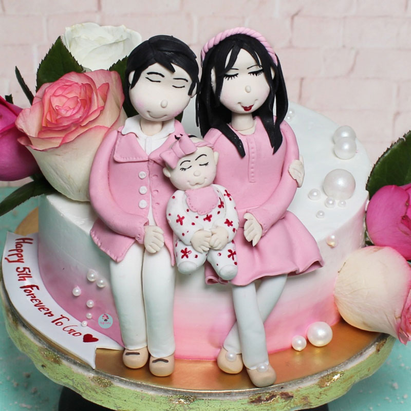 Couple with a Baby Cake